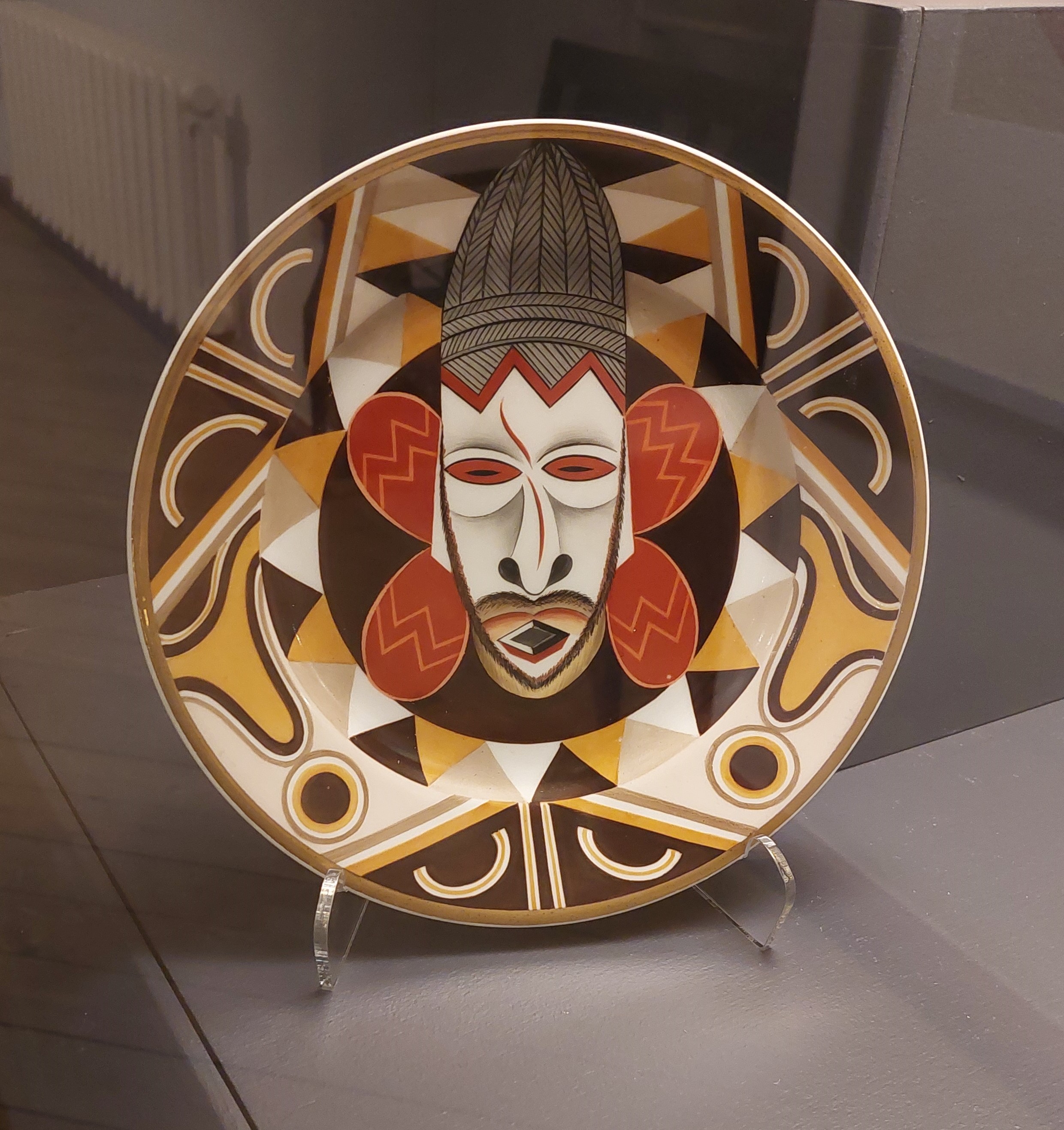 Decorative plate by Aleksandra Beļcova, Negro Motif (Fantasy), 1926. Decorative plate. Museum of Decorative Arts and Design, Riga, Latvia.